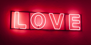 A red neon sign that spells LOVE